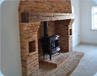 Traditional Brick Fireplace by Buff Construction